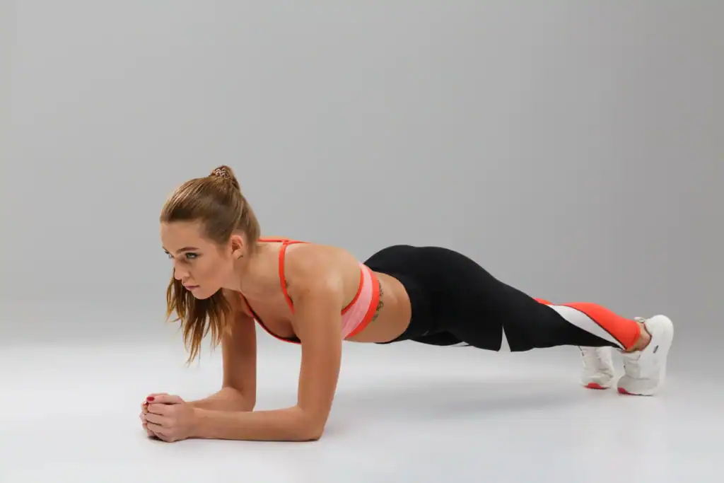 a woman practicing Plank a form of Best Ab Exercises for stong core