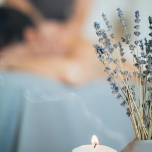 A soothing massage setting with lavender and candlelight for relaxation and aromatherapy.